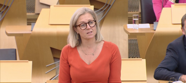 Photo of Rachael in the Scottish Parliament Chamber 